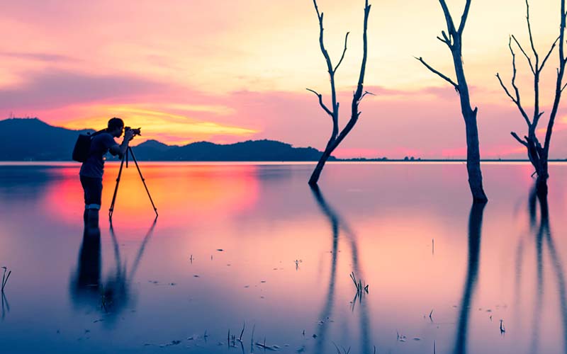 photographer at sunset